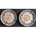 A pair of Chinese early 20th century dragon plates, character marks to base, D.24cm