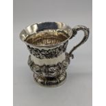 A William IV silver mug with chased designs of flowers and grapes, hallmarked London, 1831, maker
