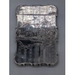 A Continental silver card case depicting a castle, vacant spray cartouche, marks to inside of lip,