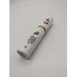 A 19th century silver and porcelain lipstick holder, decorated with floral sprays, fruit and