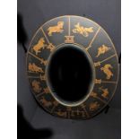An oval shaped mirror depicting Roman numerals and horoscopes, H.122cm W.100cm