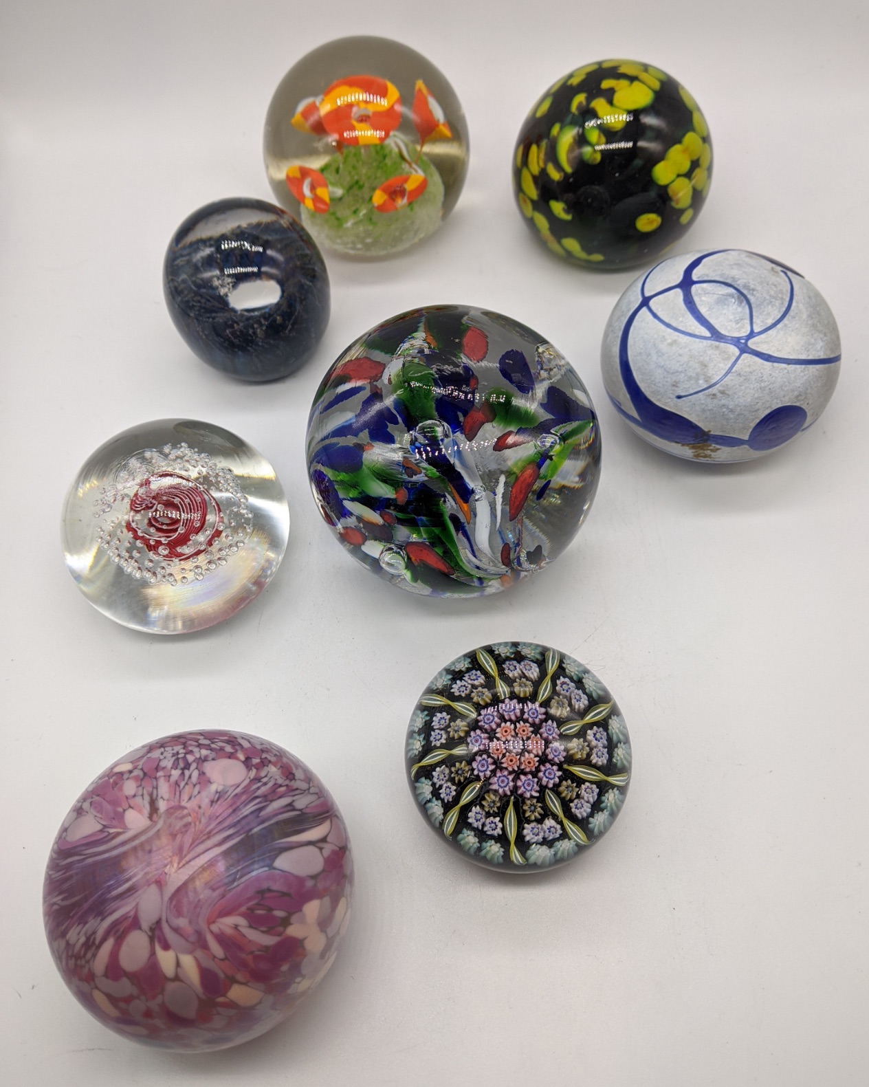 A collection of glass paperweights (8)