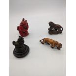 Two Japanese netsukes in the form of a tiger and a leopard, both signed, a coral snuff bottle in the