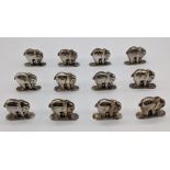 A set of 12 silver elephant place card holders, stamped 925 with one other indistinct hallmark, 74g,