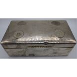 An early 20th century silver cigar box, mounted with four coins, indistinct British hallmarked,