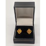 A pair of 9ct white gold citrine and diamond cluster earrings, 1cm