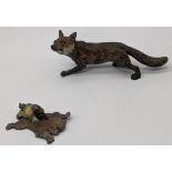 An Austrian cold painted bronze fox L.15cm, and a boy on a tiger skin rug, L.7.5cm