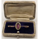 A Victorian gold brooch mounted with an amethyst and pearls, unmarked, 3g, L.4cm