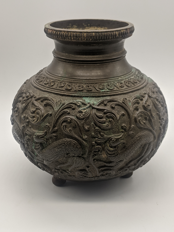 A 19th century Indian bronze ablutions or lota vessel, scrolling decoration depicting animals,