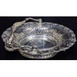 A George II silver cake basket, pierced with swing handle, pie crust edge with shell decoration,