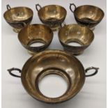 Set of 5 Middle Eastern silver cup saucers and matching larger twin handled example, etched