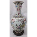 A large Chinese late Qing Dynasty porcelain bottle vase, decorated with scenes of birds amongst