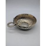 A 19th century or earlier French silver wine taster, serpent handle, 121g, D.10cm