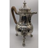 An early Belgian silver teapot, raised on three claw and ball feet, removable finial, 1510g, H.31cm