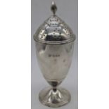 A large silver sugar shaker, hallmarked London, 1937, maker Richard Woodman Burbridge, retailed by