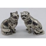 A pair of Victorian silver cat and dog peppers, hallmarked London, 1876, maker Edward H.Stockwell,