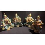A Late Ming Dynasty or earlier Chinese set of four large sancai-glazed temple-roof figures depicting