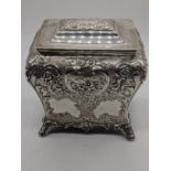 A Victorian Scottish silver tea caddy, repousse embossed decor, crest to the front cartouche,
