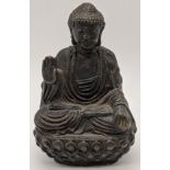 A 19th century or earlier seated Tibetan bronze Buddha, H.13.5cm, W.8cm,