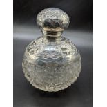 An Edwardian silver and cut glass jar, scrolling decoration, screw top lid, hallmarked Birmingham,