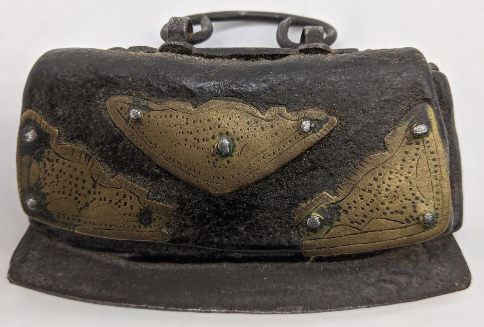 A Tibetan leather tinder pouch and striker (Icag) with brass mounts, L.10cm