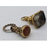 Two Georgian fob seals, mounted with 18ct gold (tested), one in carnelian, total weight 14g, H.2cm