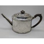 A George III silver teapot by Hester Bateman, etched decoration, one vacant cartouche, one cartouche