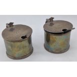 A pair of Georgian style silver salts, hallmarked London, 1937, maker Reid & Sons, crest, blue glass