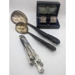 A small collection of silverware to include two cased napkin rings, hallmarked Chester, 1916, maker,