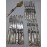 A collection of mother of pearl handled flatware, some with silver blades