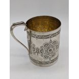 A Victorian silver mug with etched decoration, gilt interior, initialled, hallmarked London, 1872,