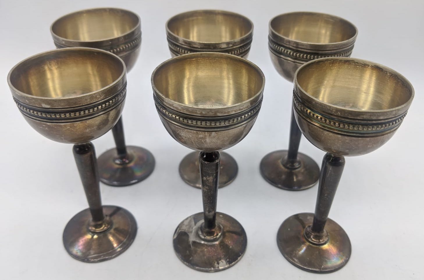 A set of six 20th century continental silver egg cups, possibly French, indistinct mark to base, H.