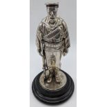 A Victorian silver inkwell in the form of a Royal Navy seaman from H.M.S. Duke of Wellington,