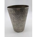 An early 20th century Indian silver beaker, chased scrolling decoration, H.13.5cm, 398g
