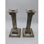 A pair of Victorian silver candlesticks, weighted bases, hallmarked London, 1899, maker Goldsmiths &