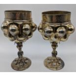 A pair of 18th century silver gilt German marriage cups, etched bandings depicting figural scenes,