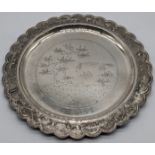 A silver Vietnamese circular dish with central landscape scene and embossed border, D.25.cm, 353g