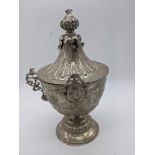 A 19th century Italian silver vase and lid in the neoclassical style, two flanking appliques