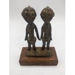 A late 19th century Senufo tribal bronze study of a male and female figure, Ivory Coast, raised on