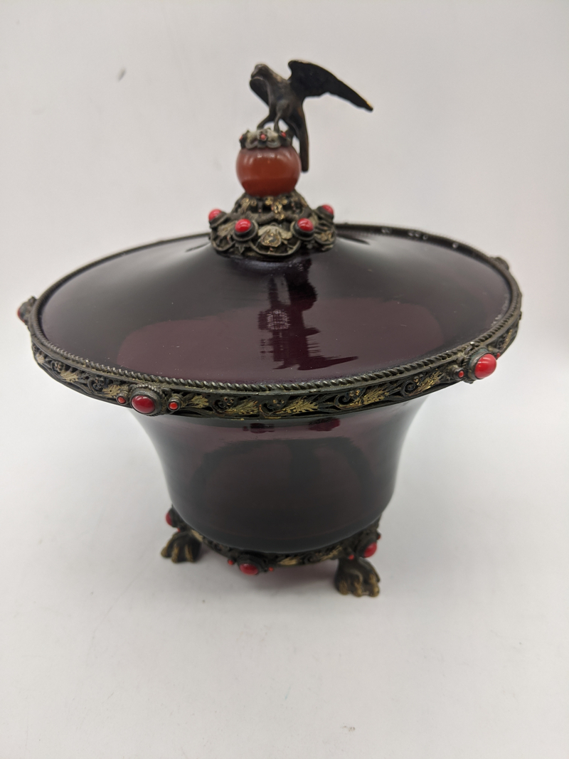 An Austrian silver and purple glass bowl with lid, finial in the form of an eagle on an amber