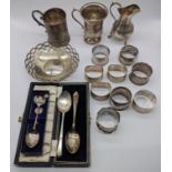 A collection of silver items to include, a Victorian Christening jug, one other Christening, a