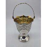 A Victorian silver sugar basket, etched decor, swing handle, gilt interior, hallmarked London, 1867,