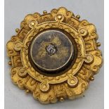 A gold gilt brooch with central diamond, D.3.5cm