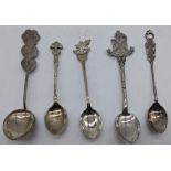 A small collection of silver teaspoons (five pieces), including one with Chinese characters, another