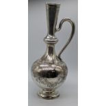 A late 19th century Russian silver wine ewer, etched decoration, vacant cartouche, marks to base,