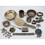 A collection of Indian silver items to include tea strainer, bowls, bracelets, pendants,