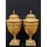 A pair of Regency olive wood urns, acorn finials, interior liners, H.61cm