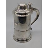 A George III silver tankard with lid, stag head crest, hallmarked London, 1766, maker FM, 687g, H.