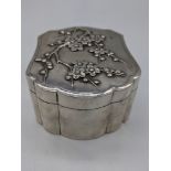 A Chinese export silver box, embossed with lotus, marks to base, 160g, H.4.5cm L.8cm