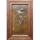 An Art Nouveau copper panel embossed with a maiden and owl, H.66cm W.38cm (total item size)